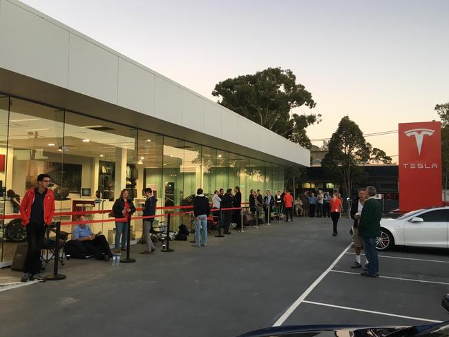 Andreas Stephens with other Tesla buyers outside the Tesla shop in St Leonards, Sydney, to place their order for a Tesla Model 3. Picture: Supplied