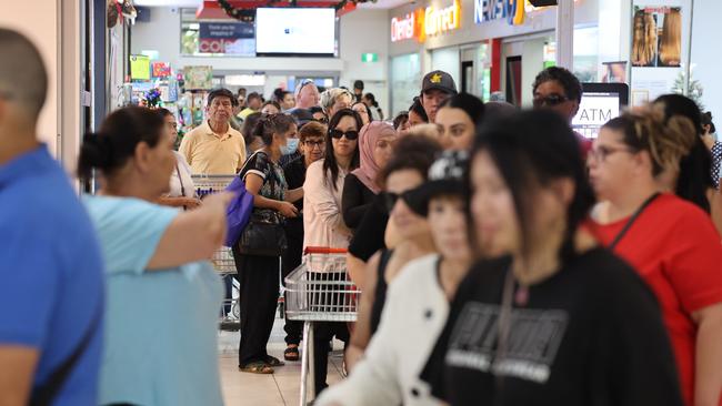 Queues for the free groceries in Fairfield. Picture: Rohan Kelly