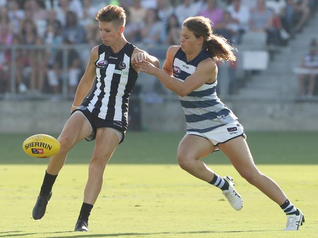 Morrison applies pressure to Pie Emma Grant during Geelong’s debut win. Picture: AAP