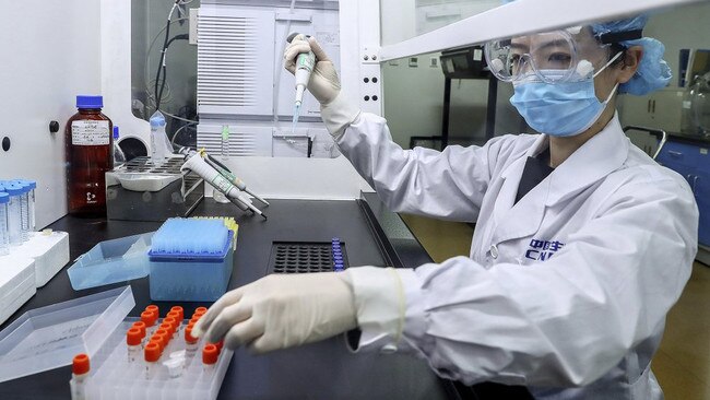 A staffer tests samples of a potential vaccine at SinoPharm in Beijing in April. Picture: Xinhua via AP