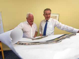 CEO of Signature Care Graham Croft looks over plans of previously built aged care homes with Member for Page Kevin Hogan. Picture: Adam Hourigan