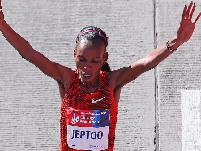 CHICAGO, IL - OCTOBER 12: Rita Jeptoo of Kenya celebrates after winning of the 2014 Bank of America Chicago Marathon on October 12, 2014 in Chicago, Illinois. (Photo by Jonathan Daniel/Getty Images)