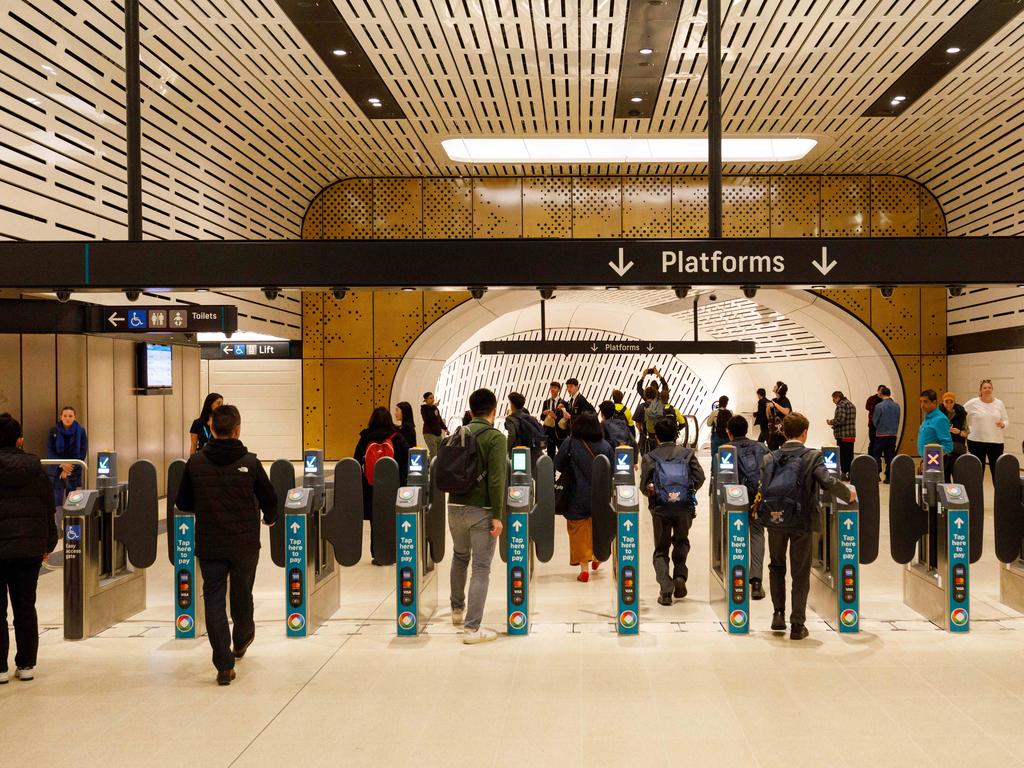 SYDNEY, AUSTRALIA - NewsWire Photos. August 19 2024. Commuters use the opal pay gates at Victoria Cross Metro station on the opening day of the Sydney Metro. Picture: NewsWire / Max Mason-Hubers