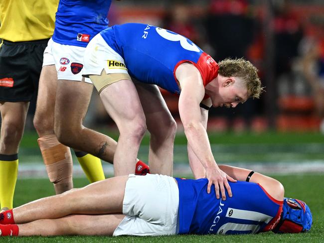 Clayton Oliver checks on Angus Brayshaw. Picture: Getty Images