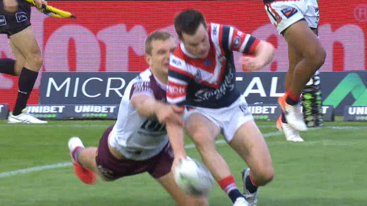 Luke Keary drops the ball cold under pressure from Tom Trbojevic.