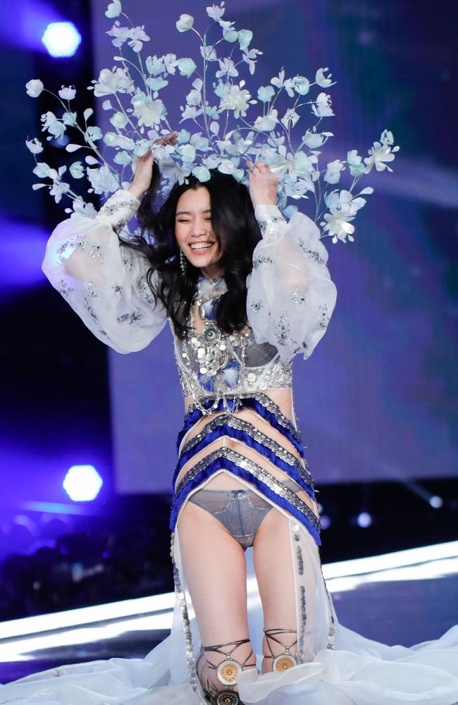 Ming Xi takes a tumble at the 2017 Victoria's Secret Fashion Show in Shanghai, China. Picture: J.Lee, Film Magic