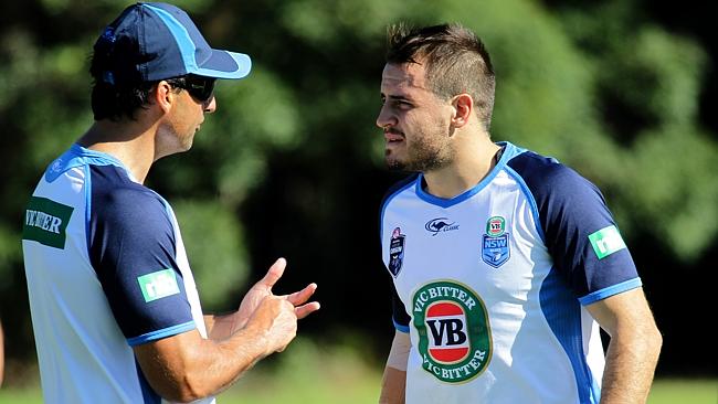 NSW coach Laurie Daley talks to Josh Reynolds at training.