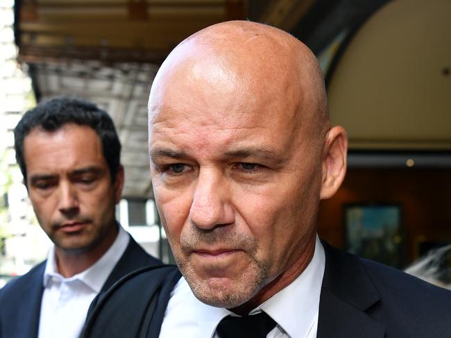 Gary Jubelin leaves Downing Centre Local Court in Sydney, Wednesday, February 5, 2020. (AAP Image/Joel Carrett) NO ARCHIVING