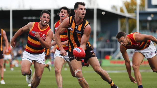 LAUNCESTON, AUSTRALIA - APRIL 25: Jaeger O'Meara of the Hawks handpasses the ball during the 2021 AFL Round 06 match between the Hawthorn Hawks and the Adelaide Crows at UTAS Stadium on April 25, 2021 in Launceston, Australia. (Photo by Dylan Burns/AFL Photos via Getty Images)