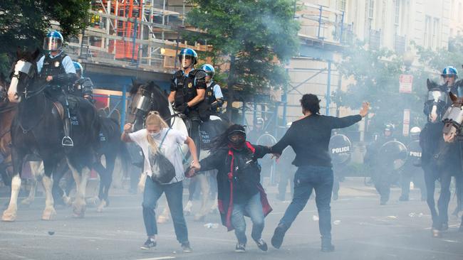 Protesters are tear gassed as the police disperse them near the White House.