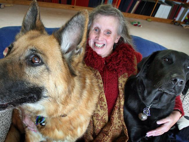 Book The Wonderful World of Dogs edited by Candida Baker, ABC Radio northern afternoon presenter and newly publisher writer Elaine Harris, who contributed stories to the book, with her best friends German shepherd Allie and labrador Rosi