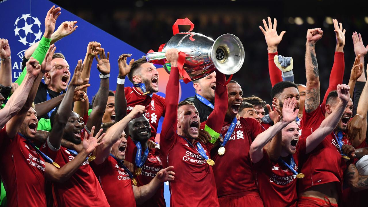 Liverpool captain Jordan Henderson lifts the Champions League trophy