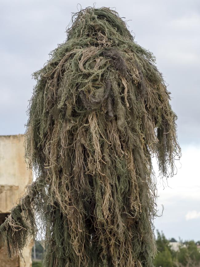 A “ghillie” suit similar to the attacker’s.