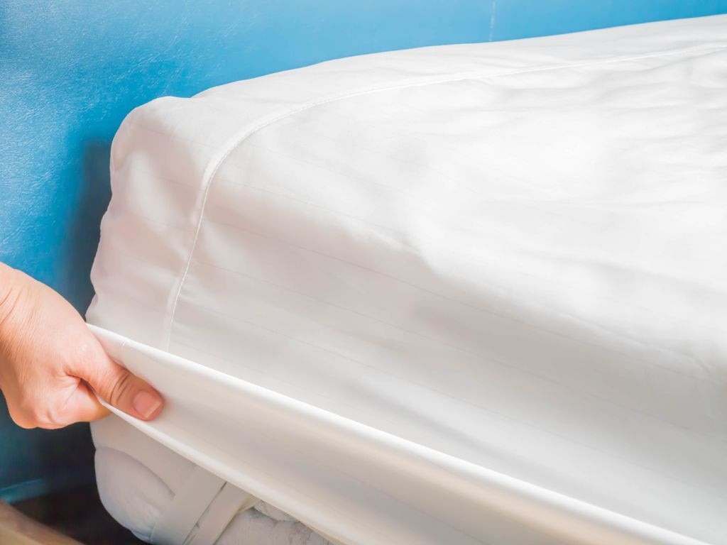 Do you prefer zippered covers or straps when fitting your bedding? Picture: iStock/penkanya.