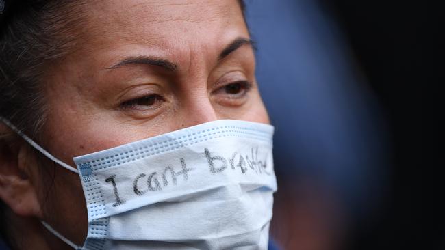 A protester wears a mask reading ‘I can't breathe’ in reference to the death of George Floyd. Picture: Getty Images