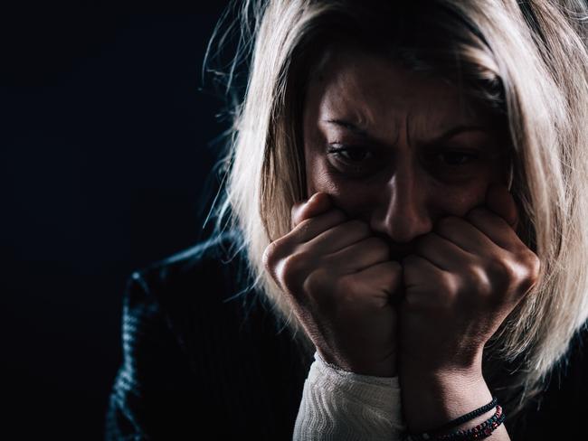scared woman domestic violence generic