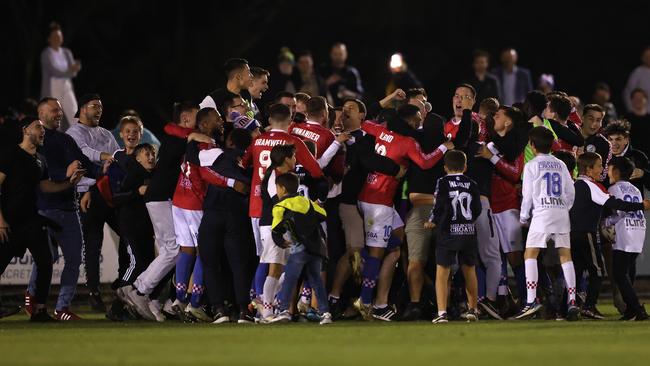 Melbourne Knights celebrate after the final whistle.