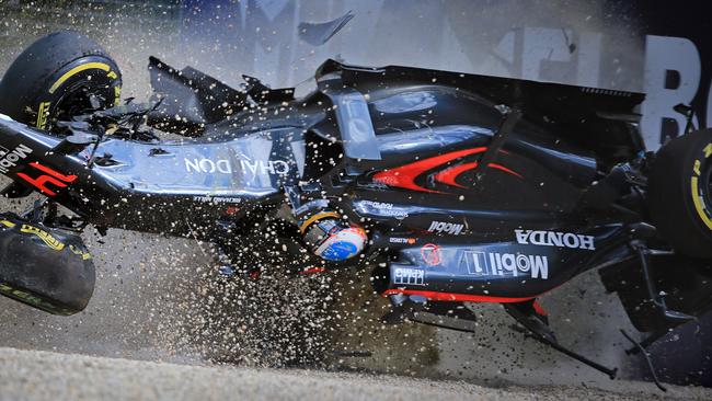 Fernando Alonso managed to walk away from this horror 305km/h crash at the 2016 Melbourne Grand Prix. Picture: Alex Coppel