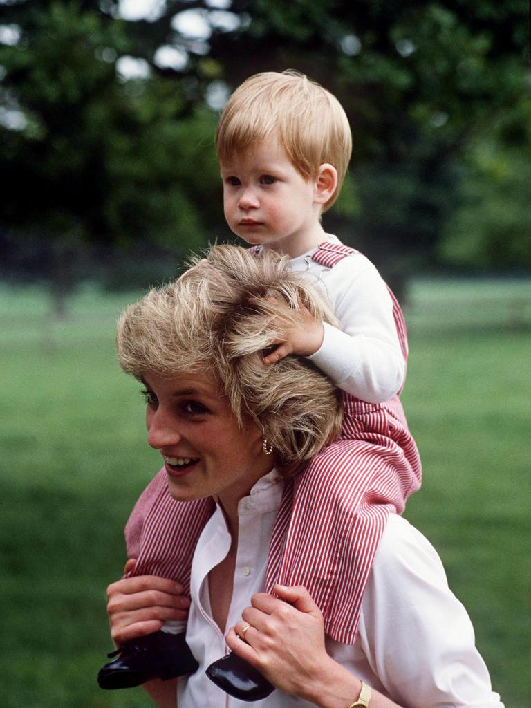 <b>1986</b>: Princess Diana carries her toddler son on her shoulders at Highgrove, showing the carefree and warm parenting style that became her trademark and broke the mould when it came to royal upbringings. Picture: Tim Graham Photo Library via Getty