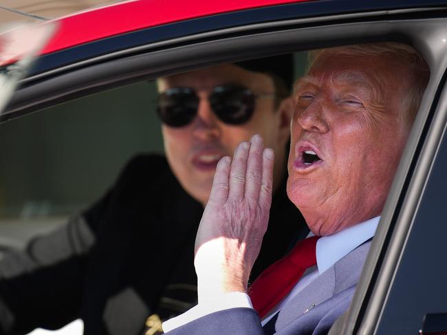 WASHINGTON, DC - MARCH 11: U.S. President Donald Trump and White House Senior Advisor, Tesla and SpaceX CEO Elon Musk sit in a Tesla Model S on the South Lawn of the White House on March 11, 2025 in Washington, DC. Trump spoke out against calls for a boycott of Elon MuskÃ¢â¬â¢s companies and said he would purchase a Tesla vehicle in what he calls a Ã¢â¬Ëshow of confidence and supportÃ¢â¬â¢ for Elon Musk. (Photo by Andrew Harnik/Getty Images)