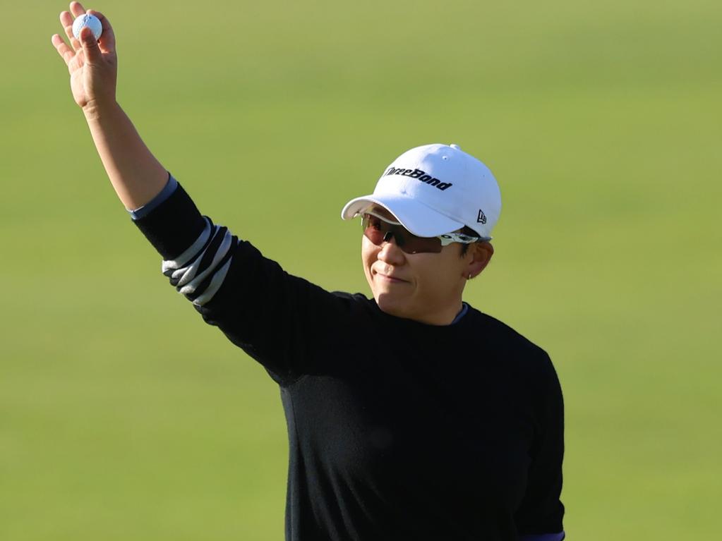 ST ANDREWS, SCOTLAND - AUGUST 24: Jiyai Shin of South Korea acknowledges the crowd following putt on the 18th green during Day Three of the AIG Women's Open at St Andrews Old Course on August 24, 2024 in St Andrews, Scotland. (Photo by Luke Walker/Getty Images)