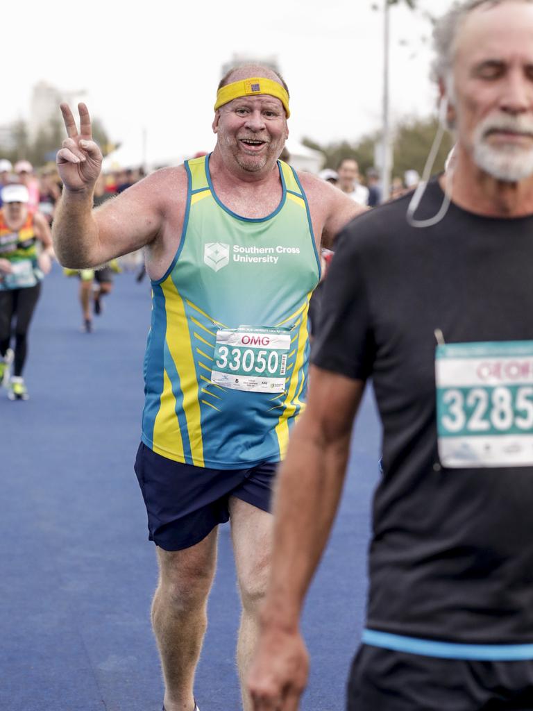 Dave Graham is happy to cross the finish line of the Southern Cross University ten kilometre Run. Picture: Tim Marsden.