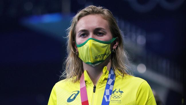 Titmus walks with her gold medal for the Women's 400m Freestyle Final. Photo: Tom Pennington/Getty Images