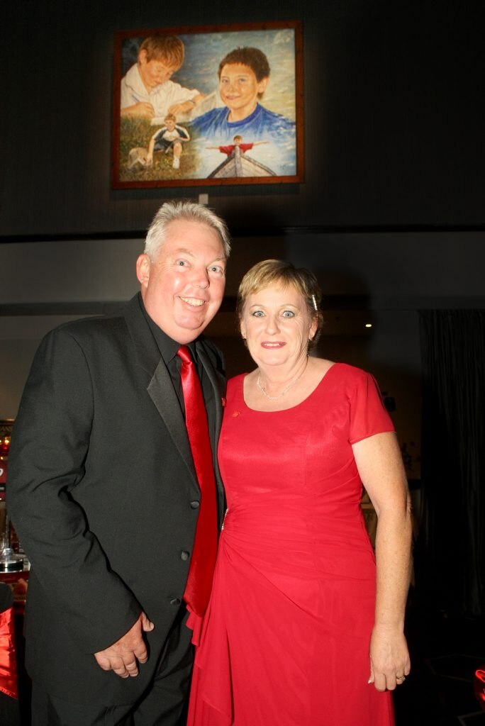 The Dance for Daniel at the Caloundra RSL. (L-R) Denise and Bruce Morcombe in front of a painting of Daniel. . Picture: Nicola Brander
