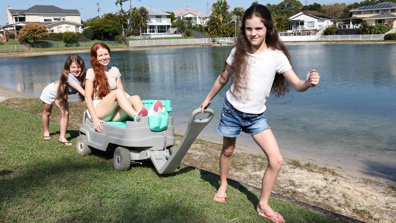 Regan Merka shows off the Burleigh Wagon with daughters Maddie (left) and Lilly. Picture: Glenn Hampson.