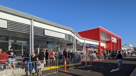 A crowd outside Coles at Flagstone at 6.45am.