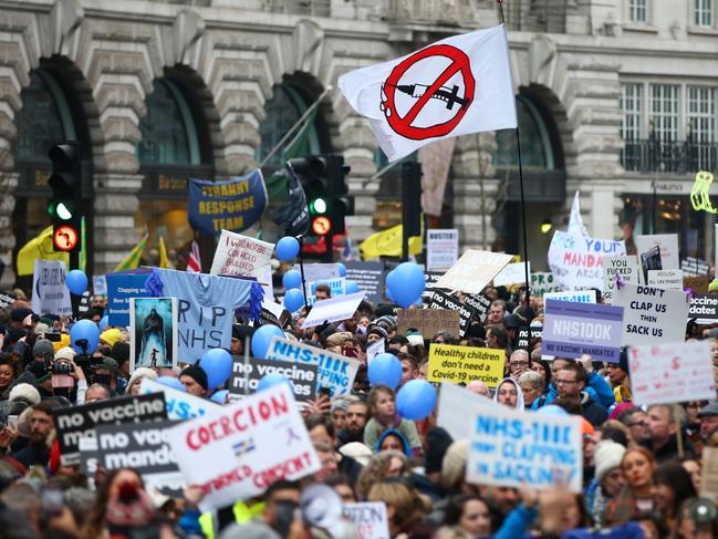 Activists march down Regent Street in London. Despite the government abandoning Plan B restrictions next week protesters are demanding a stop to Covid vaccines for children and vaccine mandates. Picture: Getty Images