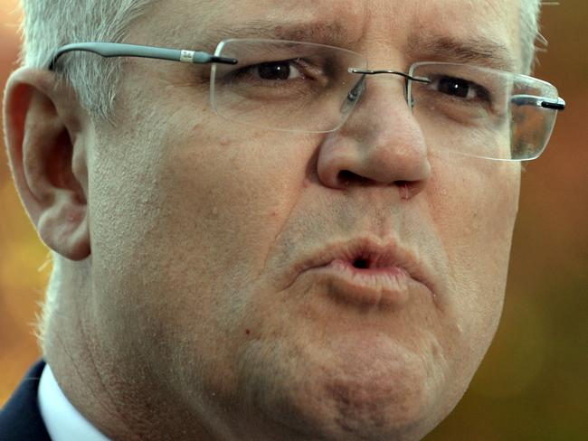 Australian Federal Treasurer Scott Morrison arrives for a photo opportunity before he delivers the Budget later today at Parliament House in Canberra, Tuesday, May 3, 2016. (AAP Image/Sam Mooy) NO ARCHIVING