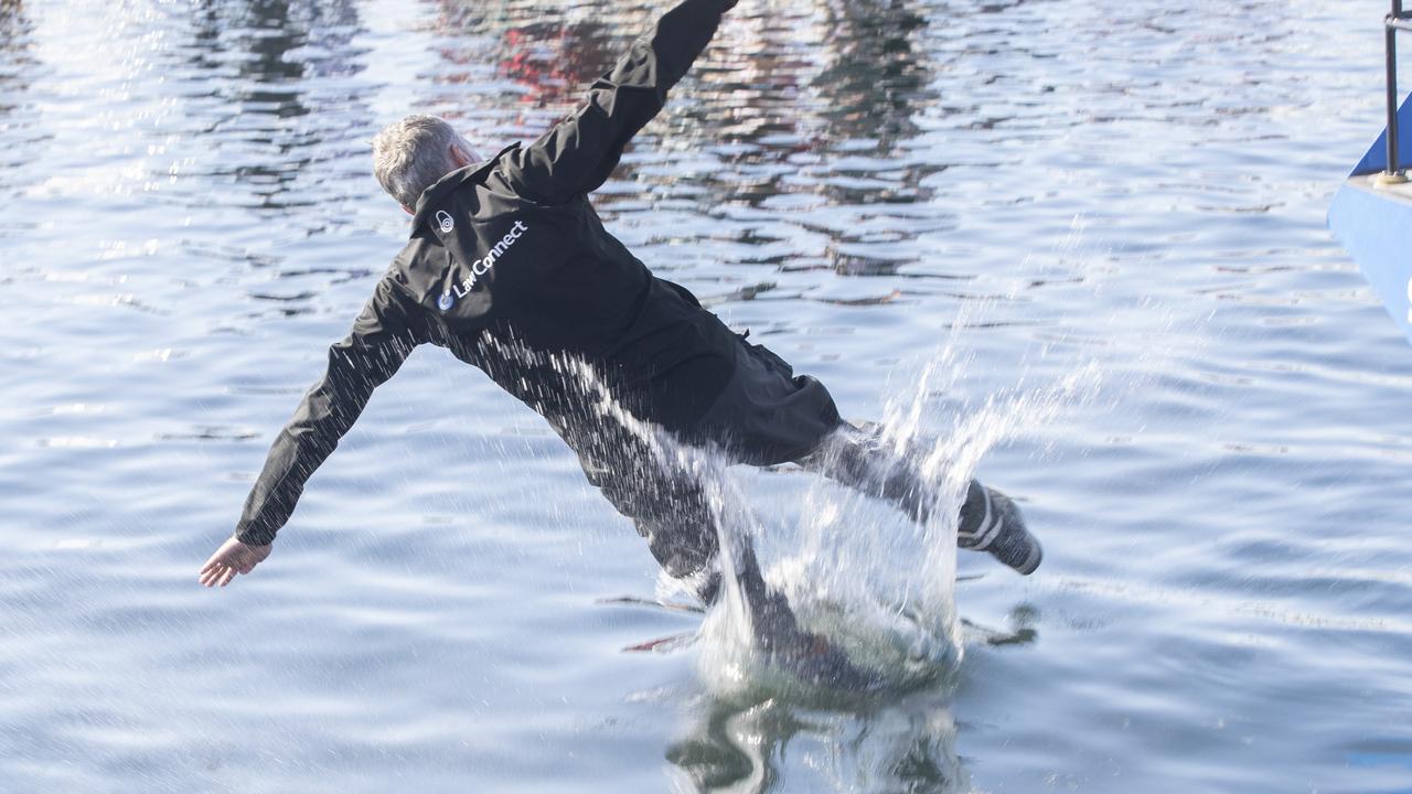 LawConnect skipper/owner Christian Beck is thrown overboard after winning the 2023 Rolex Sydney Hobart yacht race. Picture: Chris Kidd