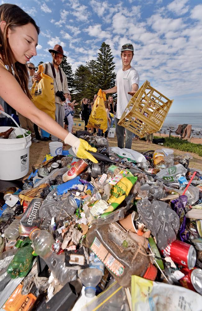 Volunteers add to a mound of rubbish collected during the Plastic Free event at Avalon Beach. Picture: AAP