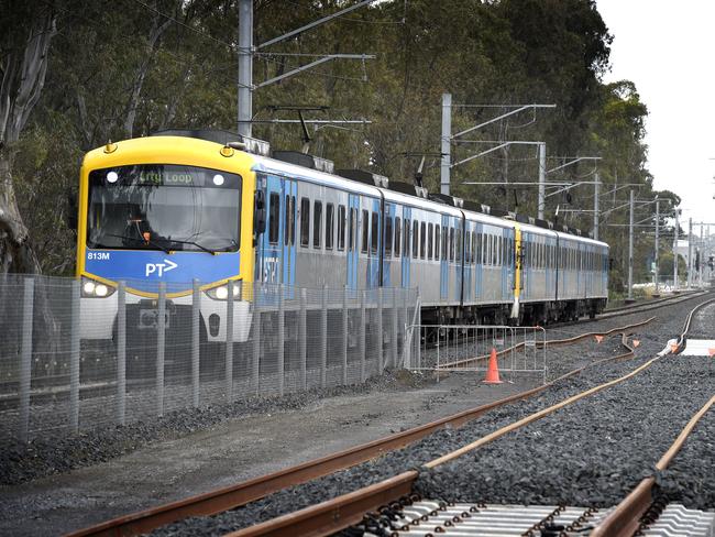 MELBOURNE, AUSTRALIA - NewsWire Photos NOVEMBER 04, 2021: A Metro train runs on the existing track next to the rail duplication project at the Cranbourne rail line in Melbourne's outer south-east. Picture: NCA NewsWire / Andrew Henshaw