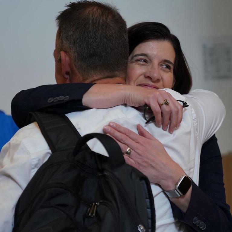 Sonja Hood hugs Alastair Clarkson.