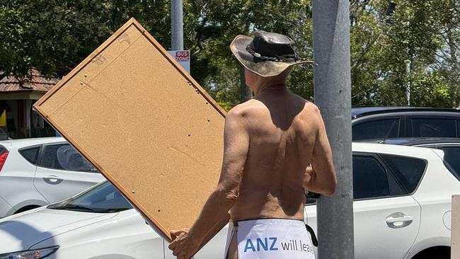 Paul Herman stripped off outside ANZ Ashgrove.