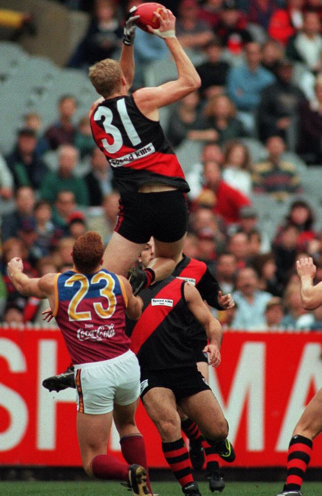 Fletcher takes a hanger over current Brisbane coach Justin Leppitsch in 1997.
