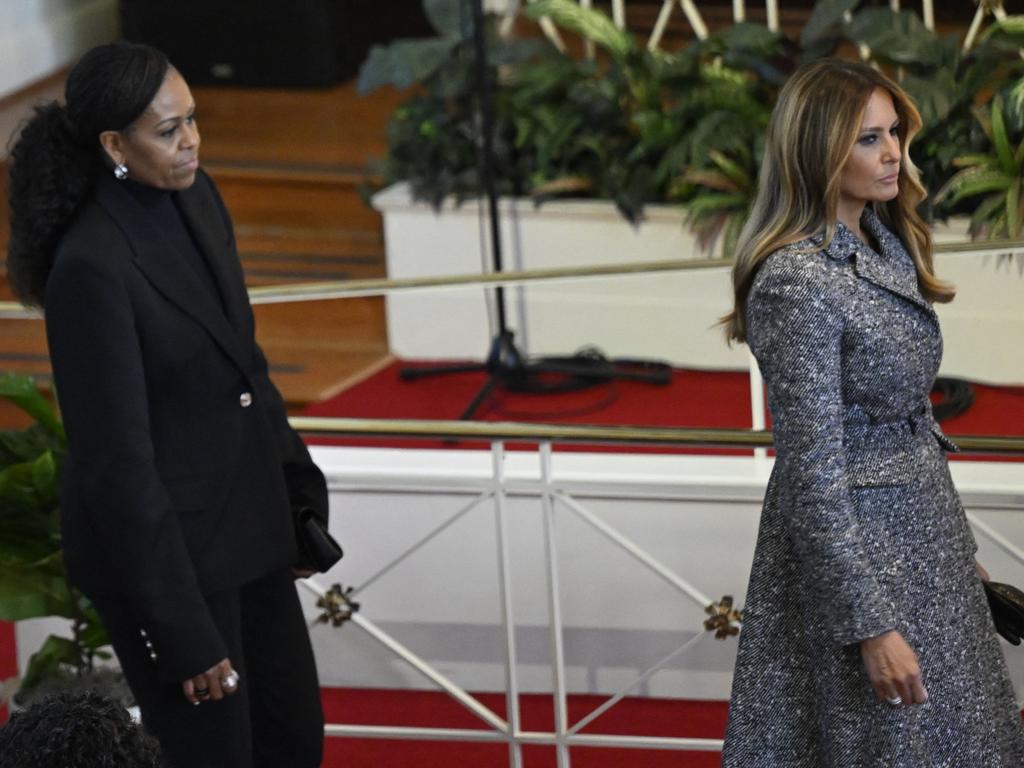 Melania Trump’s grey coat stood out from the black clothes worn by all the other first ladies a the service. Picture: AFP