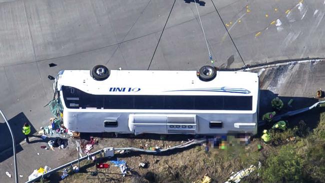 The bus on its side. Picture: NCA NewsWire / Christian Gilles