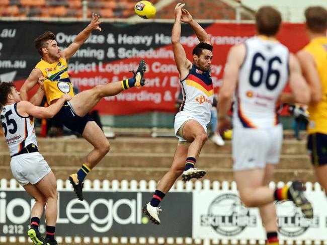 09/06/18 - SANFL: Eagles v Adelaide at Woodville Oval.  Eagle Thomas Gray and Adelaide's Domenico Costanzo fly for the ball.Picture: Tom Huntley