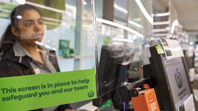 Woolworths has introduced plexiglas screens to protect its workers. Picture: Dallas Kilponen