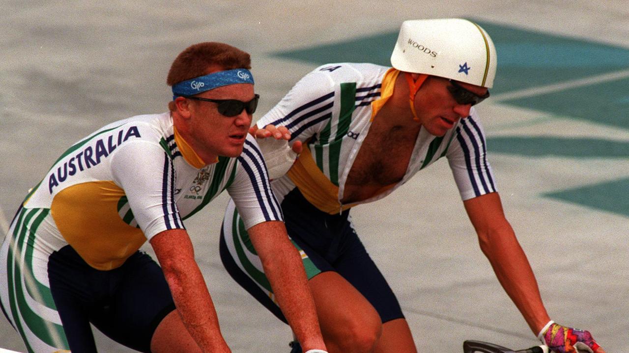 Stuart O'Grady is consoled by teammate Dean Woods after the men's pursuit at the 1996 Atlanta Olympic Games.