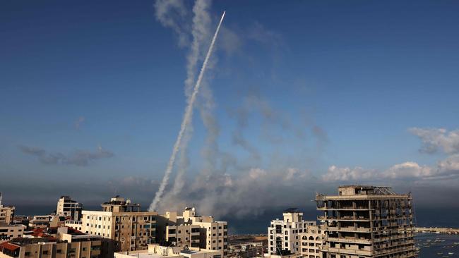 Rockets are fired from Gaza City towards Israel.