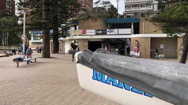 A surf boat and other surf craft have to stored on the pedestrian plaza near the Manly Life Saving Club. Picture: Jim O'Rourke