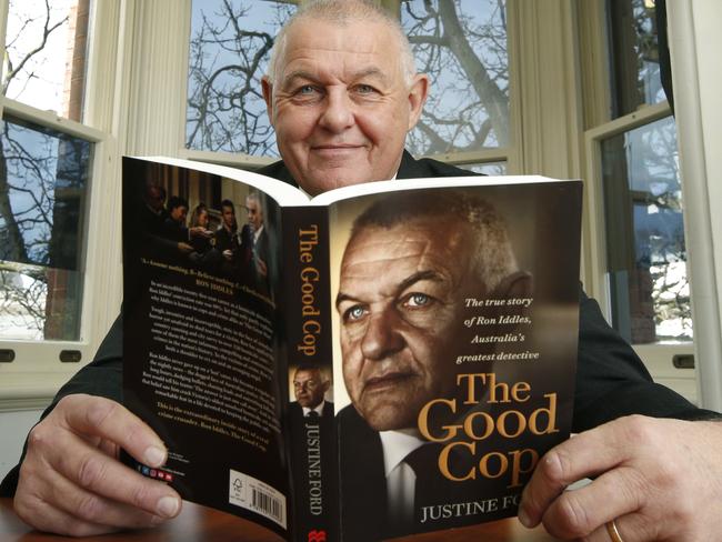 Sen-Sgt Iddles with the new book about him. Picture: David Caird