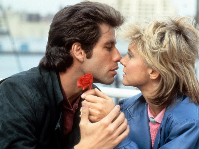 John Travolta kisses Olivia Newton-John in a scene from the film 'Two Of A Kind'.