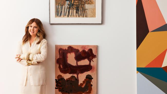 Louise Olsen wears Sportmax shirt and skirt; Louise Olsen earrings, bracelets, bangle and ring; Dinosaur Designs bangles and ring; Louise Olsen X Alex and Trahanas bangle. Artworks: top by John Olsen, right by Gemma Smith and below is Float (2023) by Louise Olsen. Picture: Michael Comninus