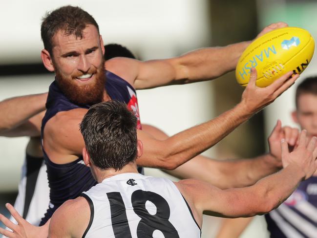 MANDURAH, AUSTRALIA - FEBRUARY 29: Connor Blakely of the Dockers handpasses the ball during the 2020 Marsh Community Series match between the Fremantle Dockers and the Carlton Blues at David Grays Arena on February 29, 2020 in Mandurah, Australia. (Photo by Will Russell/AFL Photos via Getty Images)