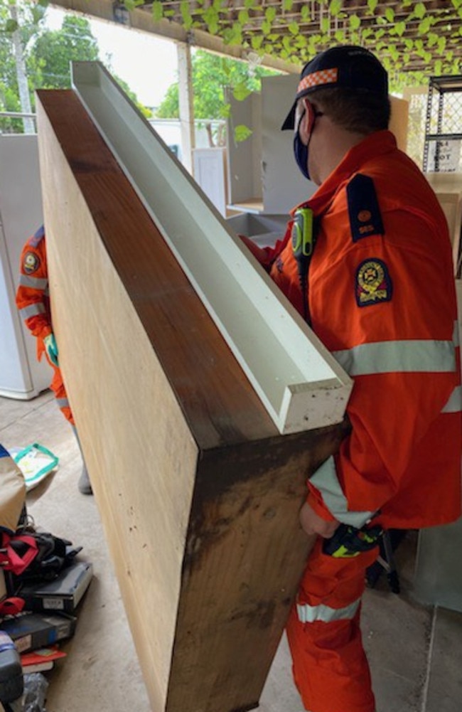 Maryborough mayor George Seymour said SES volunteers have continued to help residents affected by the floods by helping clear destroyed and damaged goods. Photo: Queensland Fire and Emergency